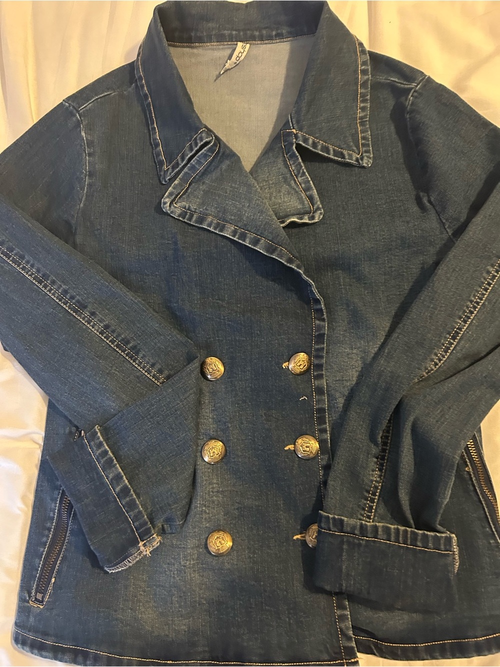 Double-Breasted Blue Denim Jacket with Gold Buttons it has spandex in material